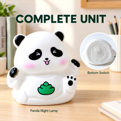 A white panda night lamp with a green leaf design, showing its bottom switch detail.