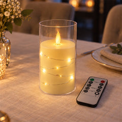 The LED candle in its clear glass cylinder, unlit and without the decorative light wire, is displayed next to its remote