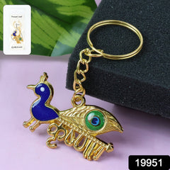 Close-up of golden Krishna Peacock keychain detail