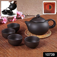 Matte black ceramic teapot with four matching cups