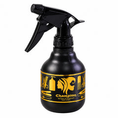 A black plastic spray bottle with a gold label and a trigger handle is centered on a white background.