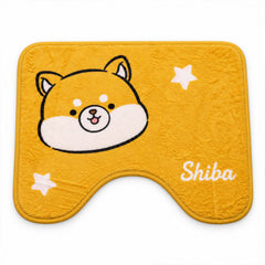 A vibrant yellow U-shaped toilet mat featuring a charming Shiba Inu character and scattered white star accents.
