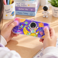 A child's hands hold a clear purple water game with an astronaut, moon, and planets design, featuring pink buttons.