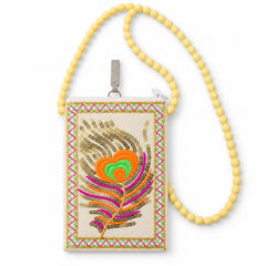 A cream mobile phone pouch with a colourful embroidered peacock feather and a long yellow beaded strap is displayed on a