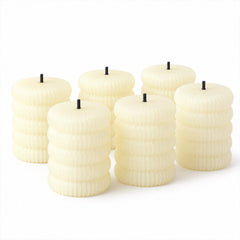 Six unlit cream-colored ribbed flameless LED tealight candles displayed against a plain white background.