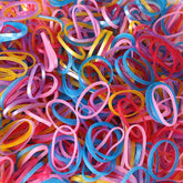 Multicolor elastic rubber bands bundle on white background