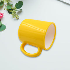 Designer coffee mug with spoon, close-up of pattern