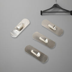 Stainless steel hooks hanging towels in bathroom