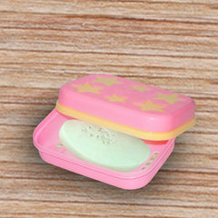 Bathroom soap holder with self-drain design and star shape.