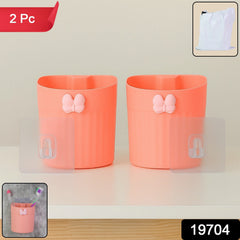 Set of two wall-mounted butterfly toothbrush holders in packaging