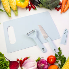 Sharp kitchen knife and chopping board in use