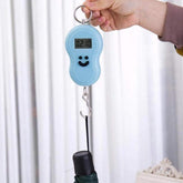 Compact digital weighing scale with LCD display, ideal for travel.