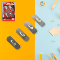 Self-adhesive hooks holding kitchen utensils