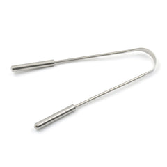MintGuard steel tongue cleaner resting on wooden surface