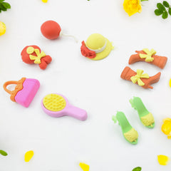 Various colorful mini erasers in animal, food, and object shapes