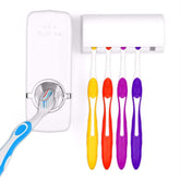 Automatic toothpaste dispenser and toothbrush holder mounted on bathroom wall