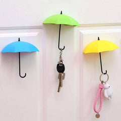 Multicolor umbrella-shaped wall hook holding keys and hats