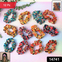 Woman wearing multiple printed scrunchies