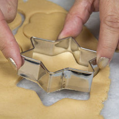 Close-up of stainless steel cookie cutters collection