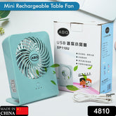 Mini rechargeable table fan on desk