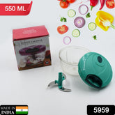 Mini vegetable chopper in action, filled with mixed chopped vegetables
