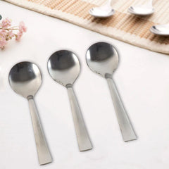 Dining spoons shown with comfort-grip handles and smooth oval bowls