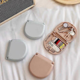 Mini portable travel sewing kit with scissors and threads