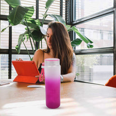 Portable motivational glass water bottle in use