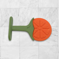 Silicone fruit teether in hand