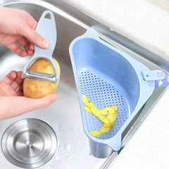Close-up of triangular sink drainer shelf with drainage holes
