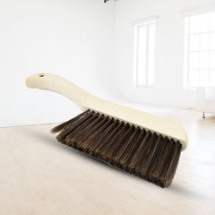 Brush for removing small particles and hair from fabric surfaces