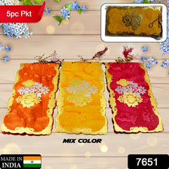 Close-up of glossy, multicolor shagun or wedding gift envelopes.