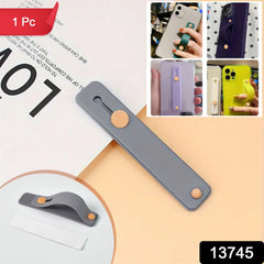 Close-up of silicone phone grip strap in use