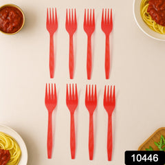 Close-up of red disposable plastic forks