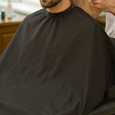Black Beard Apron Grooming Bib catching hair clippings