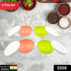 Four small plastic bowls with lids, stacked neatly