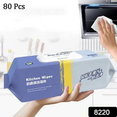 Cleaning wipes removing grease stains from kitchen surface