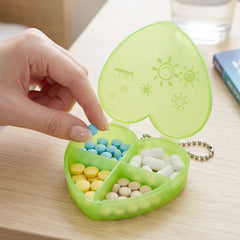 Compact pill organizer held in hand