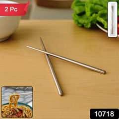 Close-up of stainless steel chopsticks on table