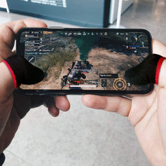 Thumb and finger sleeves used on smartphone during game
