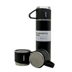 Insulated steel flask and cups on white background