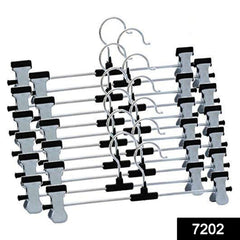 Adjustable hangers with anti-rust clips holding pants