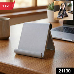 Foldable phone stand holding smartphone for viewing