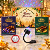 A festive hamper with two boxes of wafer rolls, a USB star galaxy light, and a silver coin.