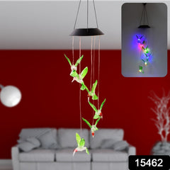 Close-up of hummingbird solar light hanging outdoors