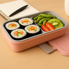 Lunch box open displaying two compartments and cutlery slot