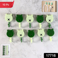 Adhesive hooks on wall holding keys and cables