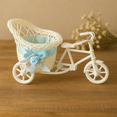 Bicycle-shaped plastic flower pot stand on white background