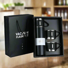 Vacuum flask with splash of coffee and steel cup