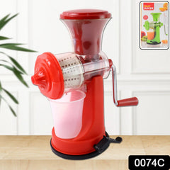 Juicer clamped on kitchen counter with fresh juice
